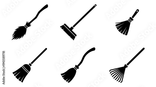 Collection of six black silhouette brooms on a white background