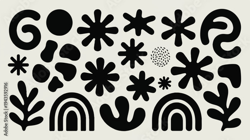 Black and White Tuxedo Cat with Yellow Eyes on Gray Background