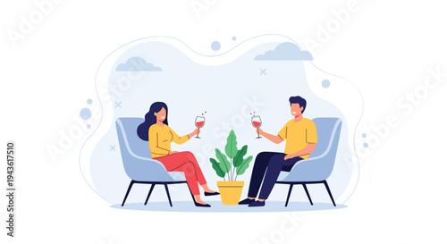 Happy man and woman enjoying a relaxed conversation while sitting in armchairs and holding glasses of wine in a cozy atmosphere.