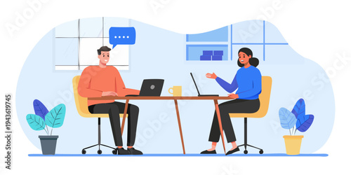 Two people having a virtual meeting or interview using laptops