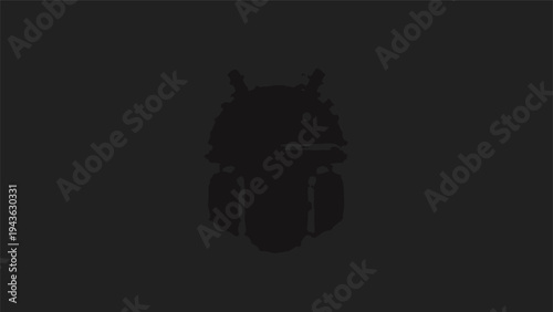 Silhouette of a majestic owl perched on a branch.