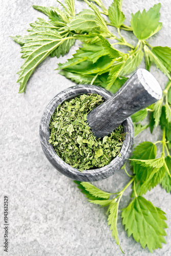 Nettle dried in mortar on stone table top