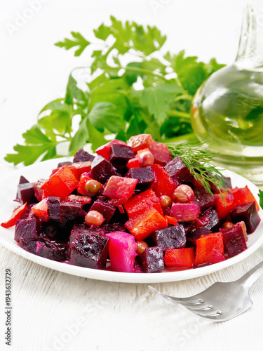 Salad of beetroot and pea on wooden board