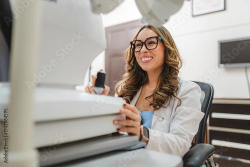Optometrist working in ophthalmic office providing vision care