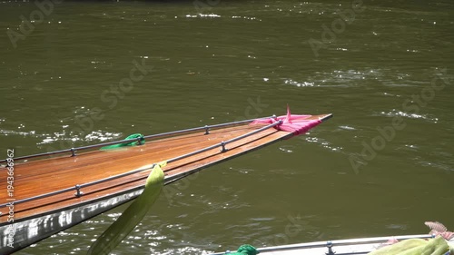Longtail boats transport tourists along the Khwae Noi River.