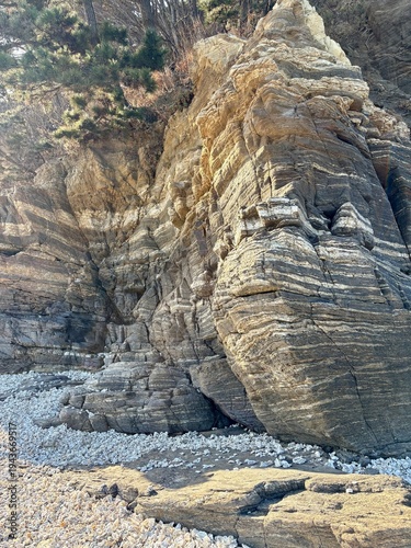 A magnificent island rock with a clearly visible strata