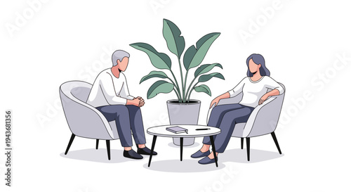 Two people in conversation in comfortable chairs.