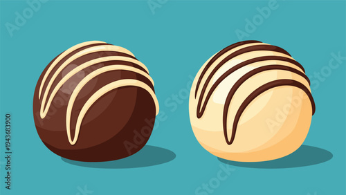 Pair of gourmet chocolate truffles, one dark chocolate and one white chocolate, is drizzled with contrasting stripes.