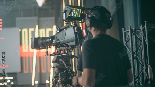 фотографія Professional cameraman filming breaking news in live TV studio with copy space