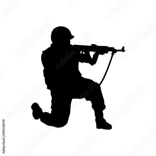 Silhouette of a Soldier Kneeling and Aiming Rifle