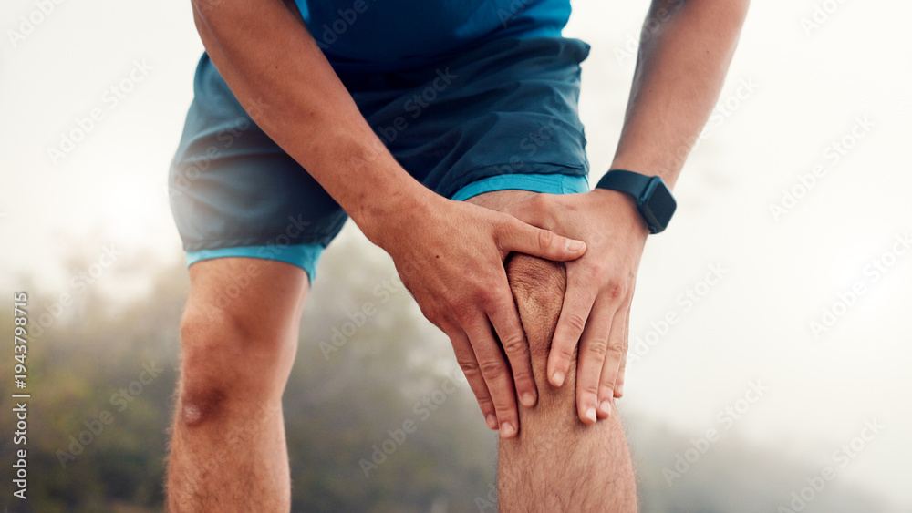 Fototapeta premium Man, hands and fitness with knee injury for workout accident, sprain or pressure in nature. Active, male person or runner with sore leg, joint inflammation or muscle tension for exercise or training
