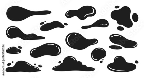 Collection of abstract black liquid ink splatters and drops on white background