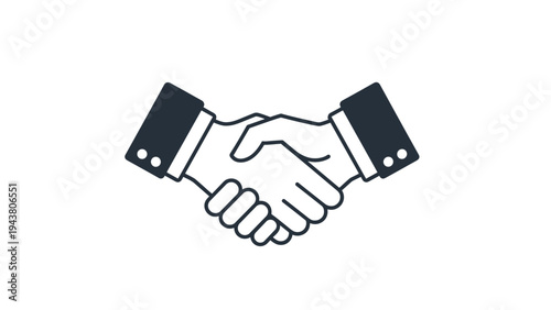 Handshake between two individuals in business attire, symbolizing agreement, partnership, cooperation, and trust.