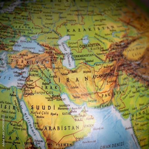 Political tension in the Middle East. A world map focused on Iran. The United States and Israel declared war on Iran. Economic and oil crises caused by the war. Countries and borders. Top view, above,