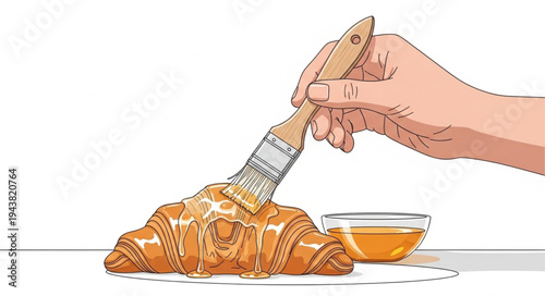 Hand spreading butter on croissant.