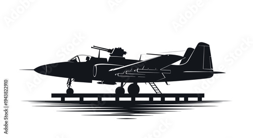 Silhouette of a vintage military jet aircraft on a platform with a water reflection.
