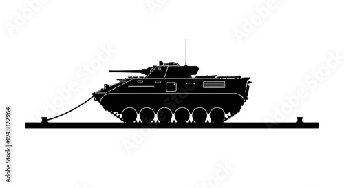 Silhouette of an armored personnel carrier (APC) on a railway track, towed by a cable.
