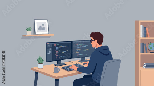 Young man programmer working on dual monitors at desk.