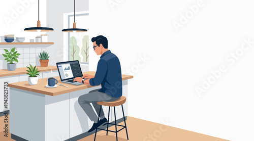 Young man working on laptop at kitchen island.