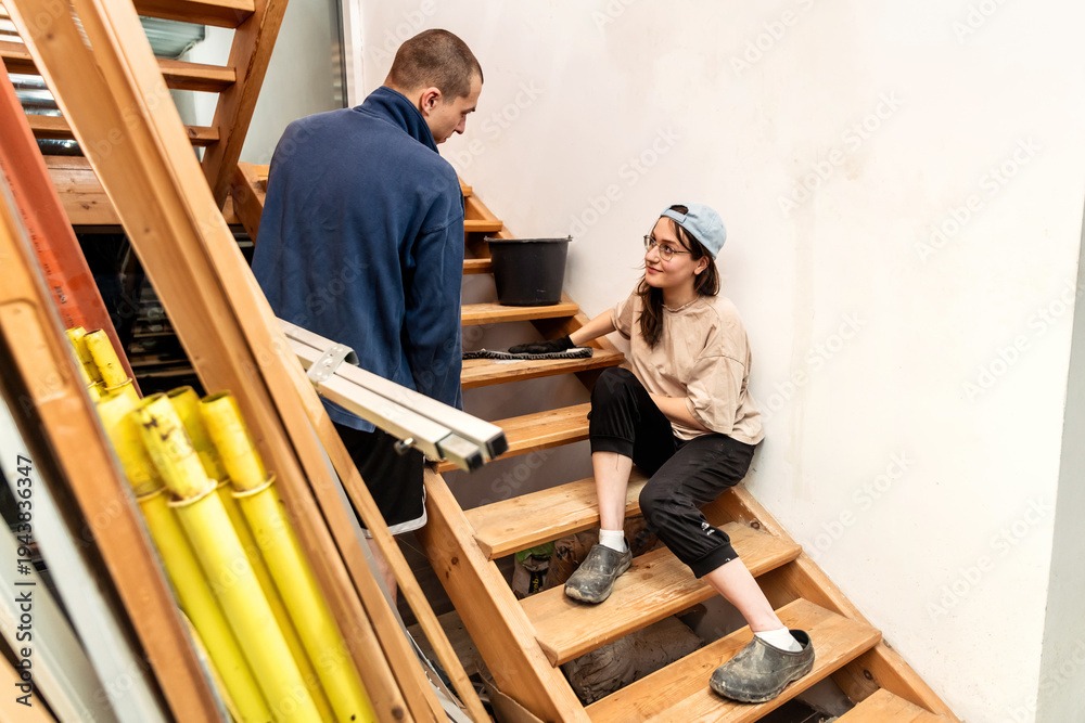 custom made wallpaper toronto digitalMan and woman repairing wooden staircase in new house.