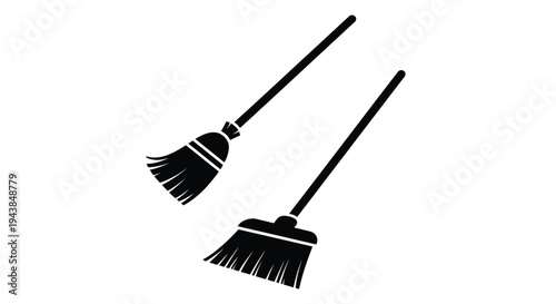 Two black silhouette witch brooms against a white background