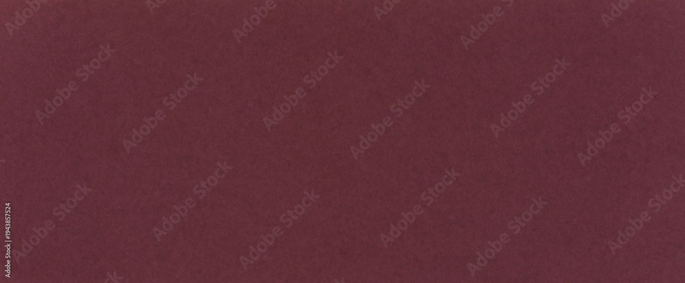 Fototapeta premium Dark red paper background with noble wine hue. Burgundy color textured surface with fine grain for design cover, branding, presentation, template, flyers, poster, elegant designs