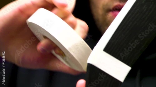 Hockey player taping stick before game