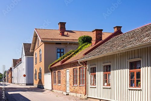 City street with old idyllic wooden houses