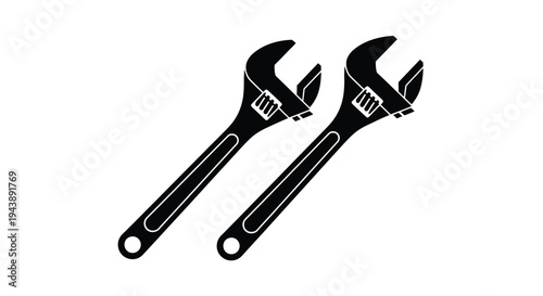 Two adjustable wrenches depicted in a simple black and white illustration