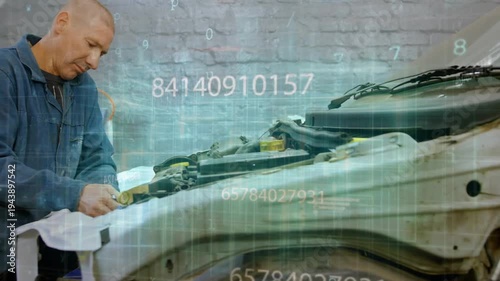 Vertical video: Auto tech inspecting bumper, tightening bolts with wrench while data grid drifting