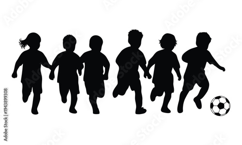 Children playing soccer in silhouette