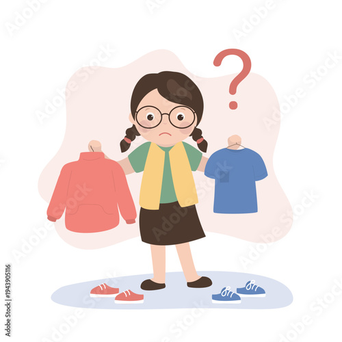 Cute kid girl choosing clothes, child trying on new clothes. Caucasian girl choosing clothes, thinking about buying T-shirt or sweatshirt. Shopping, choice, wardrobe concept.