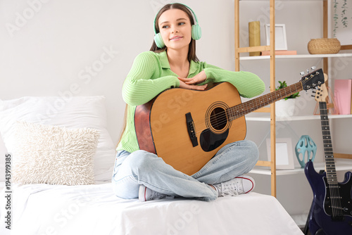 Young girl with guitar and ...