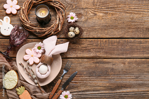Foto Beautiful table setting with different Easter cookies, eggs, burning candle and