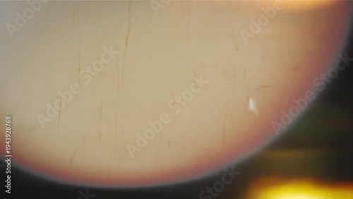 Abstract distressed film burn texture with warm light leak, scratches, dust, and dark vintage gradient. Retro photo overlay background design