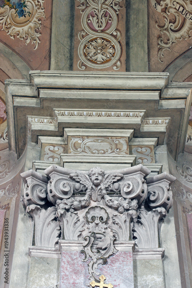 Fototapeta premium Angel on a pillar in the parish church of the Assumption in Sveta Marija na Mura, Croatia
