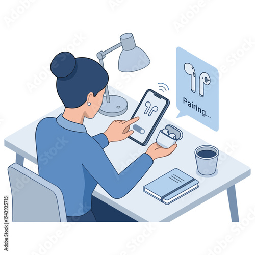 Woman sitting at desk uses smartphone to pair wireless earbuds with coffee and book nearby indoors.