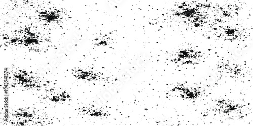 An abstract grunge design featuring black ink splats and spray paint drops creating a dirty liquid texture on a vector paper illustration