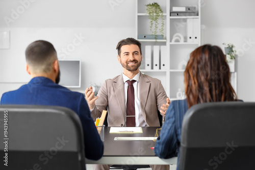 Fotografía Male court mediator working with people at table in office