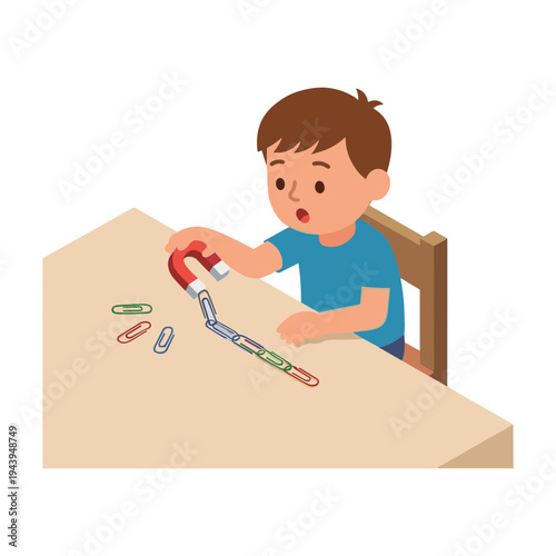 A young boy excitedly uses a magnet to attract paper clips on a table.