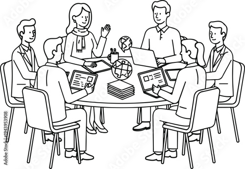 A group of people sitting around a table with laptops and books