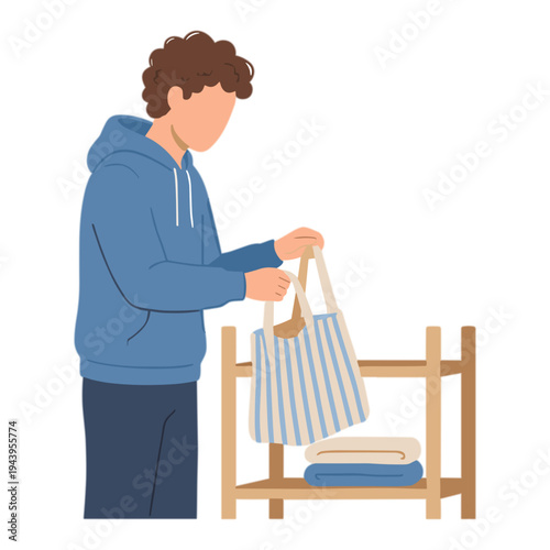 Man putting towels into a bag on a wooden rack indoors