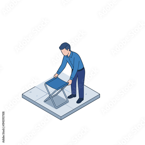 Man folding a chair on a square platform indoors carefully