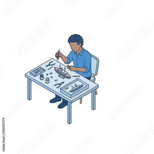 A man sitting at a table assembling a model airplane indoors.