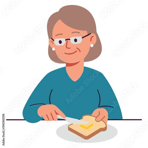Woman sitting at table spreading butter on toast with knife