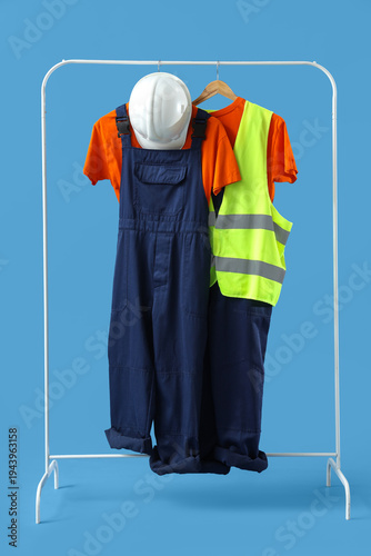 Rack with worker's uniform ...
