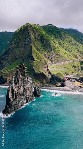 Atlantic Ocean coastline of Madeira Island featuring large sea stacks and rugged coastal rock formations