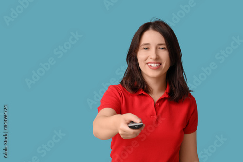 Young woman with remote con...