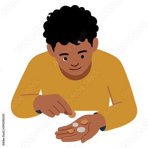 A man is holding and examining pills in his hand carefully indoors.