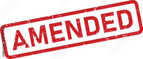A striking red amended rubber stamp with a distressed surface signals a revised or changed document status